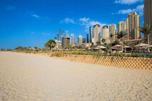 Beach and skyscrapers at Jumeirah beach in Dubai marina