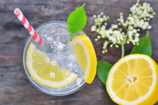 elderflower juice with lemon on old table
