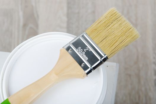 Repair. An image of paintbrush with bucket.