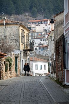 XANTHI, GREECE - FEB 22, 2015: Couple walking in the beautiful old city of Xanthi, Greece
