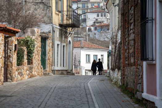 XANTHI, GREECE - FEB 22, 2015: Couple walking in the beautiful old city of Xanthi, Greece