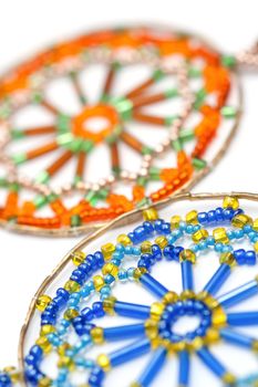 decorative craft beads in a web design inside a brass hoop