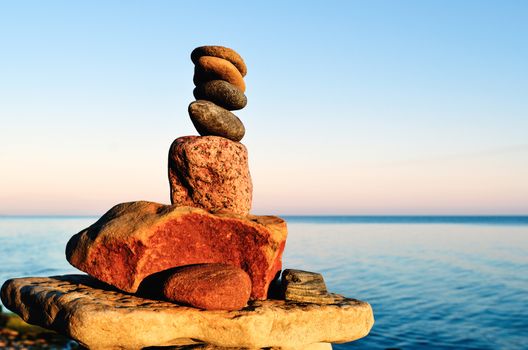 Balancing of stones each other on the seashore