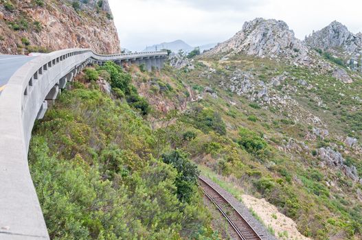 View of Sir Lowreys Pass in the Hottentots-Holland mountains near Somerset West, South Africa. The old, unused roalroad is visible. 
