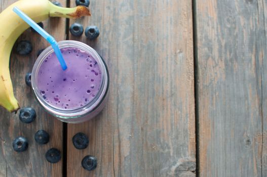 Blueberry flavored diet smoothie in a jar with space for text 