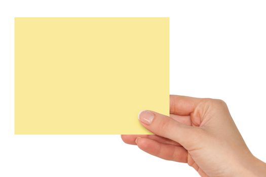 Women's fingers holding a blank yellow card