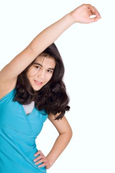 Beautiful biracial teenage girl doing stretches,exercising