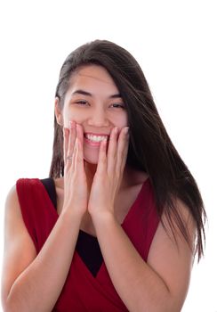 Beautiful biracial teen girl in red dress excited, hands on face, smiling