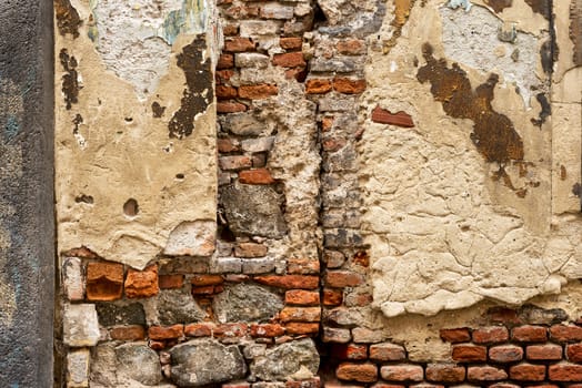 Old weathered brick wall fragment