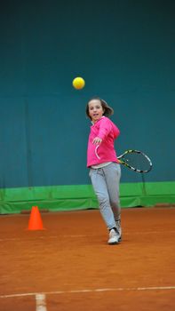 Children at school during a dribble of tennis