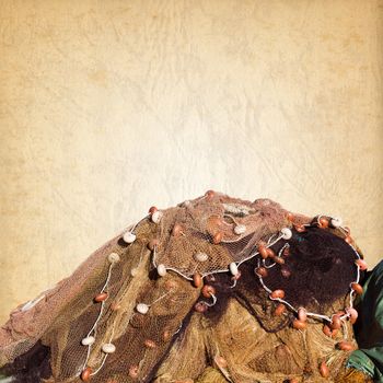 Fishing net with ropes and floats on a old brown paper
