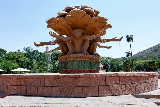 Gigantic monkey statues on fountain near bridge in famous Lost City in Sun City, South Africa.