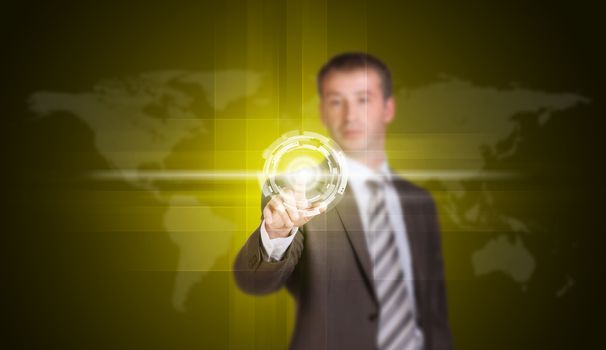 Businessman in suit finger presses virtual button. World map and glow circles