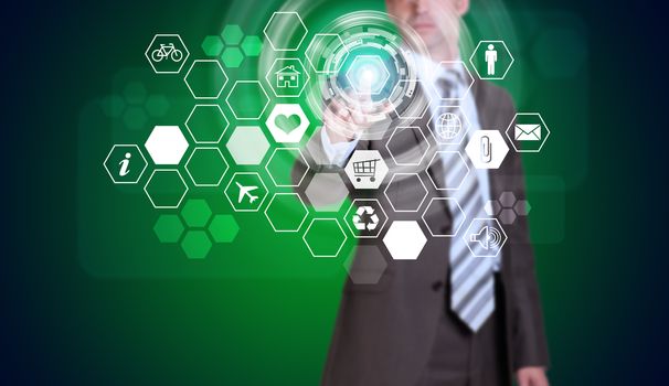 Businessman in suit finger presses virtual button. Hexagons with icons and glow circles