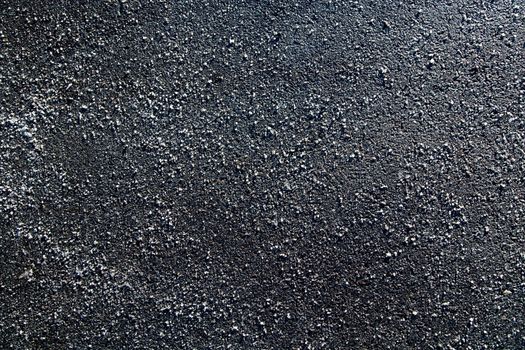 Picture of a piece of asphalt littered with salt