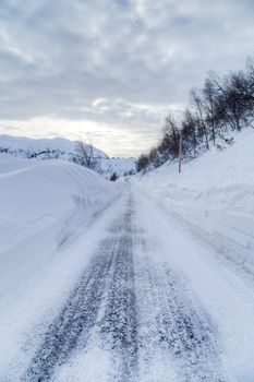 Picture of a road with a lot of snow