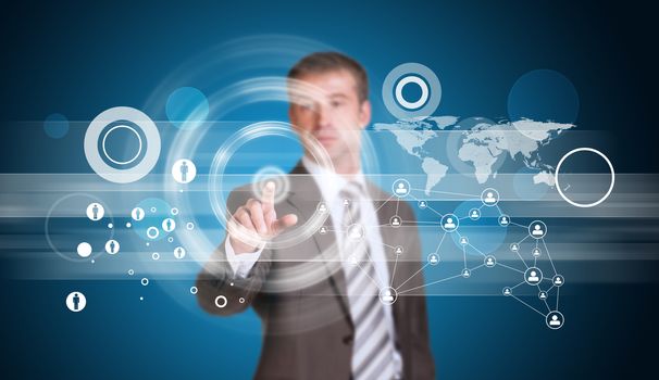 Businessman in suit finger presses virtual button. Network, circles and world map