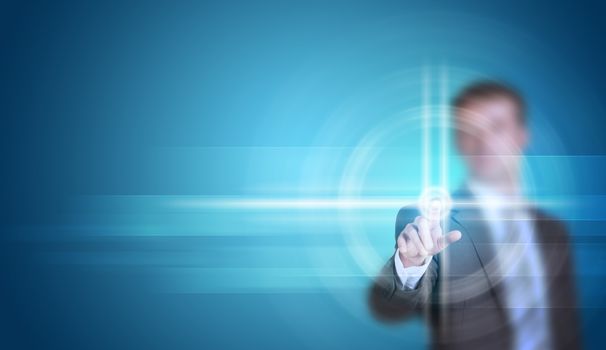 Businessman in suit finger presses virtual button. Blue gradient background