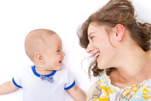 mother talks with her baby boy on withe background
