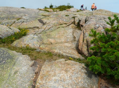 Few people at the top of rocks