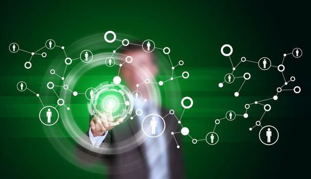 Businessman in suit finger presses virtual button. Network with icons and glow circles