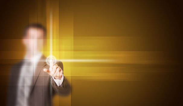 Businessman in suit finger presses virtual button. Yellow gradient background