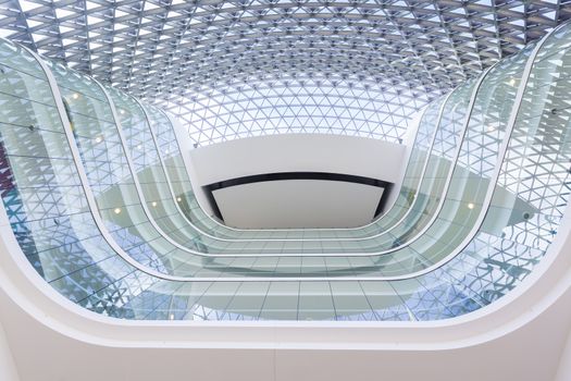 Looking up from the lobby inside a modern building