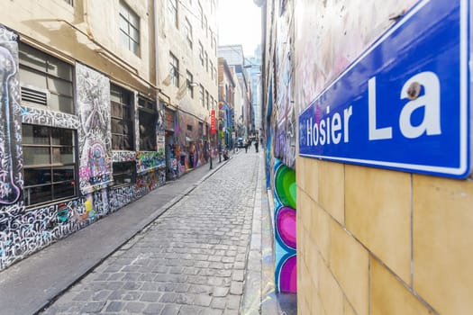 Melbourne, Australia - July 21, 2014: Hosier Lane in Melbourne, Australia. Hosier Lane is a laneway in CBD of Melbourne, It is a popular landmark in Melbourne due to its graffitti covered walls and urban art.