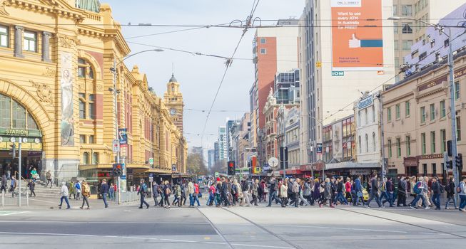 Melbourne, Australia - July 21, 2014: Busy crosswalk outside Flinders Street Station in Melbourne, Australia