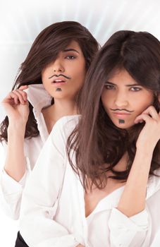 Yong twins with fake mustache make up on white.