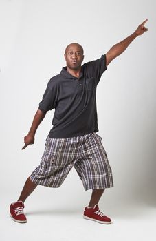 bald black man in middle of a disco move