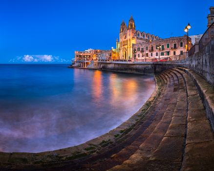 Balluta Bay and Church of Our Lady of Mount Carmel in Saint Julien, Malta