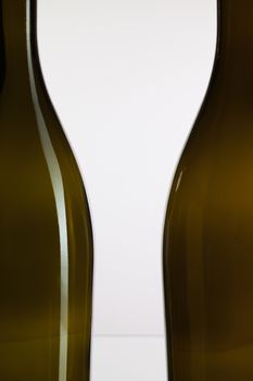 Detail of empty wine bottles on a white background