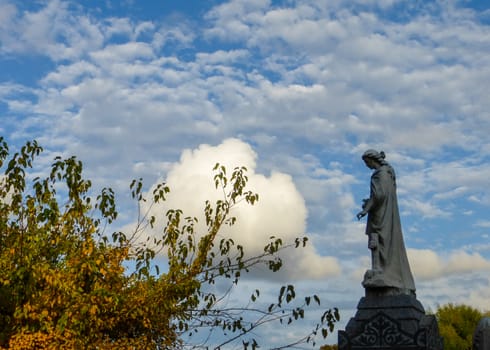 Statue in pensive mood  at cemetery