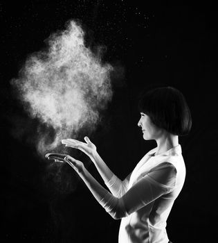 Black and white image of young woman with smoke