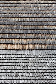 Old wooden shingle roof. Wooden surface texture.