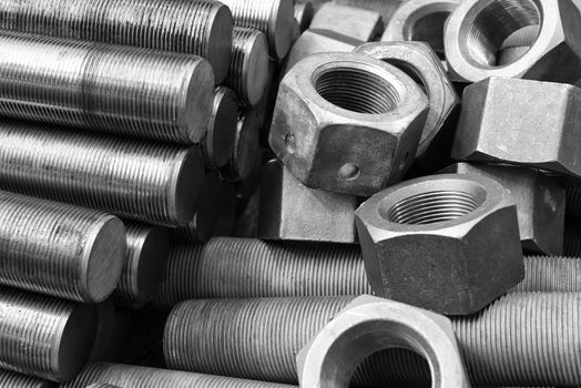 Black and white image of screws and bolts pile