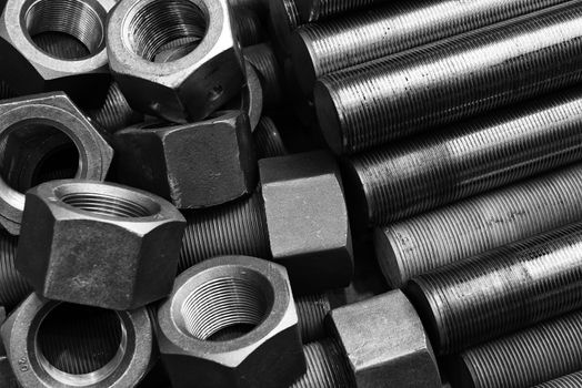 Black and white image of screws and bolts pile