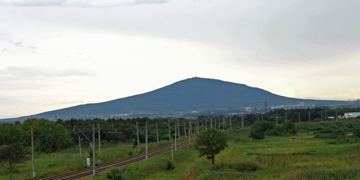 Mashuck mountain and railroad and stormy sky over