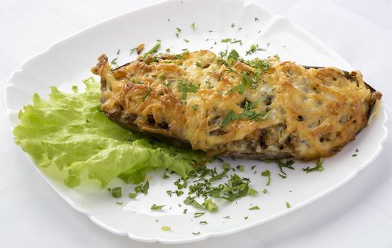 Eggplant stuffed with vegetables with mushrooms and cheese.