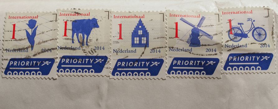 AMSTERDAM, NETHERLANDS - FEBRUARY 11, 2015: Series of stamps printed by Dutch post for international priority mail