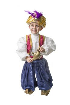 Child smilling in sultan costume with lamp 
isolated
