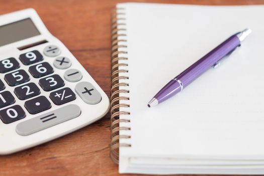 Blank notebook with pen on wooden table, stock photo