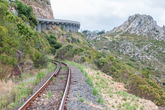 View of Sir Lowreys Pass in the Hottentots-Holland mountains near Somerset West, South Africa. The old, unused railroad is visible. 
