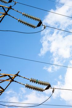 Suspended insulators of the high-voltage electric power transmission.