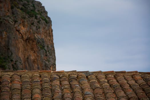 Looking at the cliff over the rooftiles at Monemvasia, Greece.