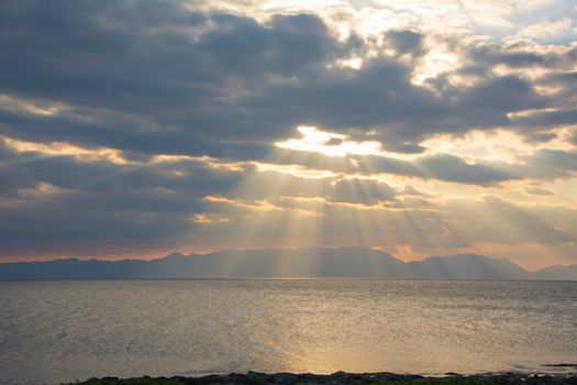 One wonderful sunset at a rocky Greek beach in Peloponnese, Greece.