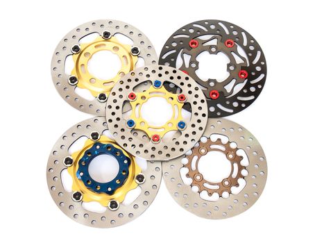 Isolated group of new disc brake for motorcycle on white background