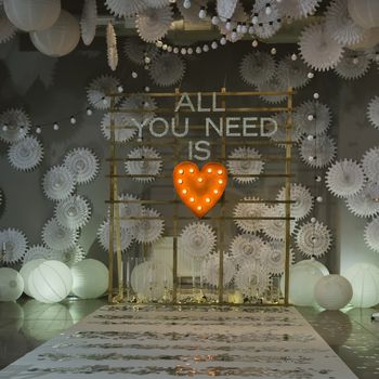 wooden arch and chairs at wedding ceremony