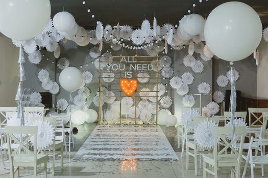 wooden arch and chairs at wedding ceremony